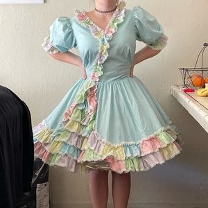 One piece square dance dress. Rainbow colored with light green primary color.